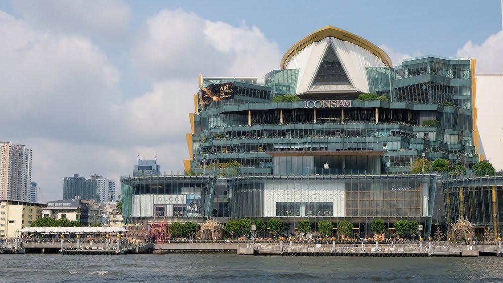 Iconsiam Mall in Thailand, highlighted by its impressive large building and striking glass roof design, an example of Thailand Real Estate Development.